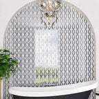 Arched bathroom accent wall with Mirror Ribbon Carrara & Mirror Mosaic Tile