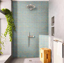 Shower backsplash finished with Misty Pearl Squares Glass Pool Tile