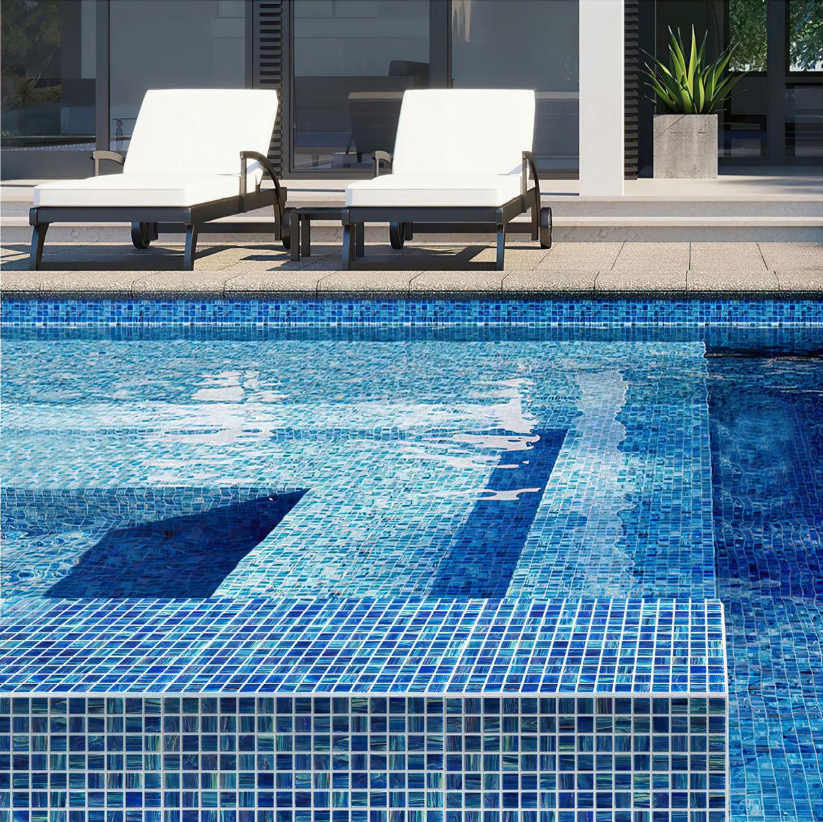 Outdoor swimming pool with Mixed Denim Squares Glass Pool Tile covered  walls 