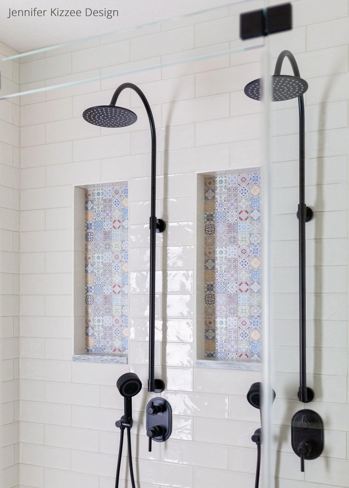 White subway tile shower with colorful niche tile in a Moroccan bathroom