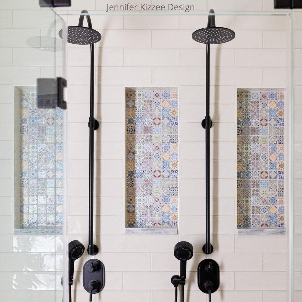 White ceramic subway tile shower with colorful Moroccan tile niche decor