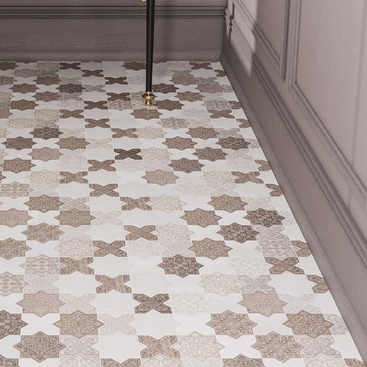 Bathroom floor with Moroccan tiles in a star and cross pattern