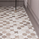 Bathroom floor with Moroccan tiles in a star and cross pattern