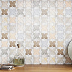Neutral marble mosaic tile kitchen backsplash with a star pattern