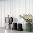 Silver Coffee Maker in Background of Neutral Blanco Trace Wall