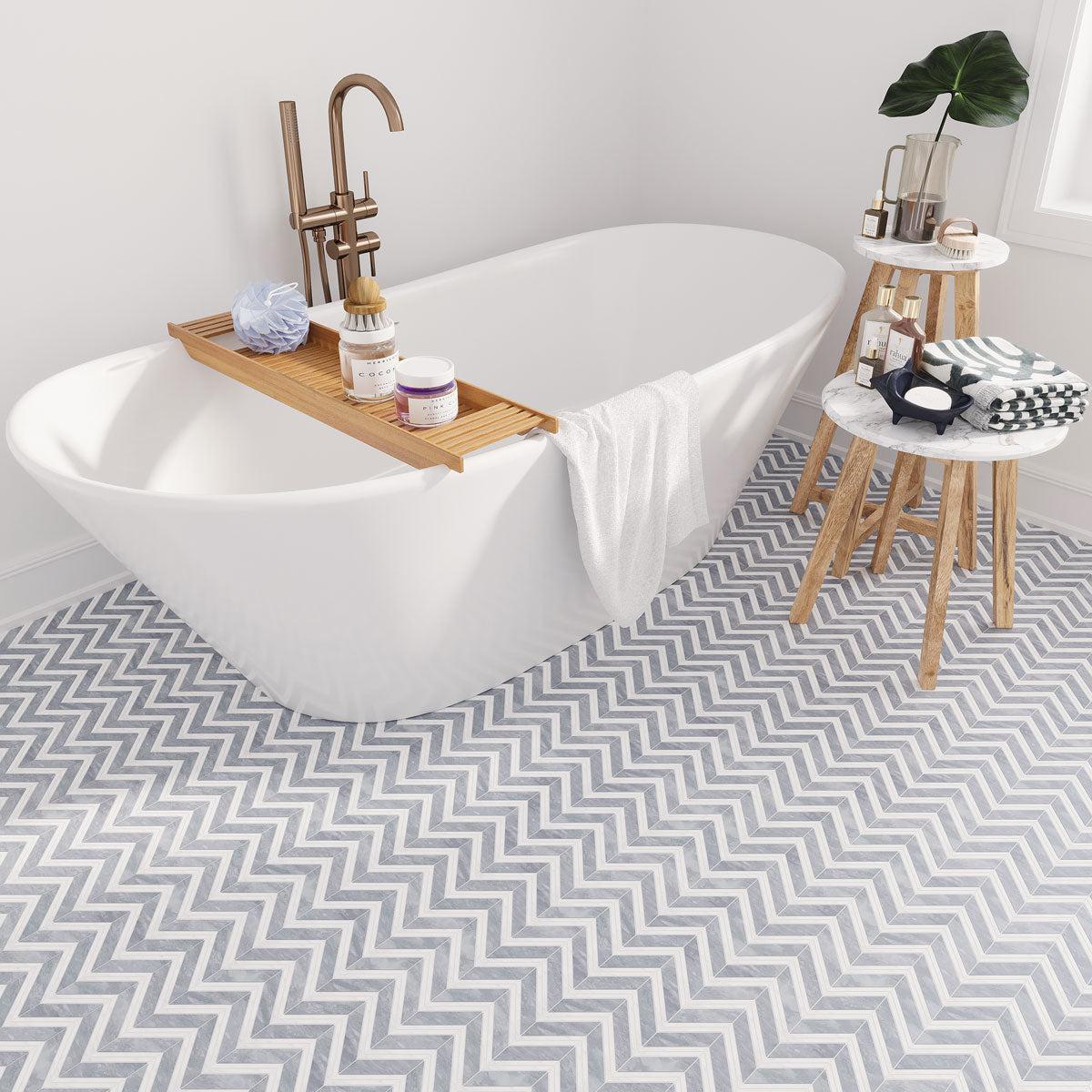 Standing Bathtub with a marble mosaic bathroom floor for extra grip