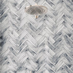 Sea Glass subway shower tiles in a herringbone layout