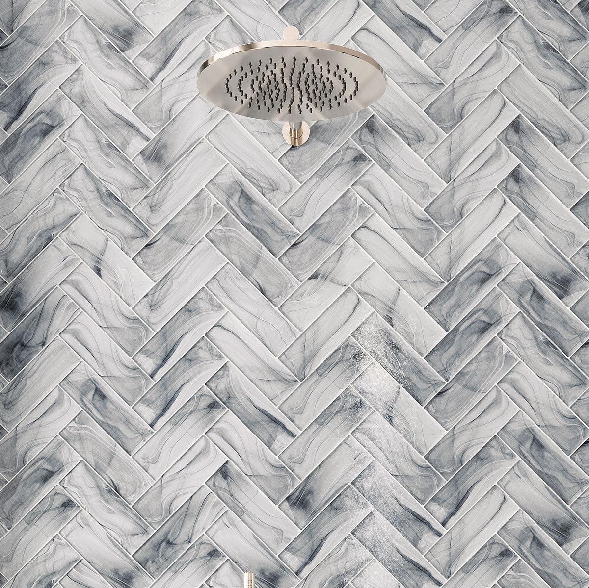 Sea Glass subway shower tiles in a herringbone layout