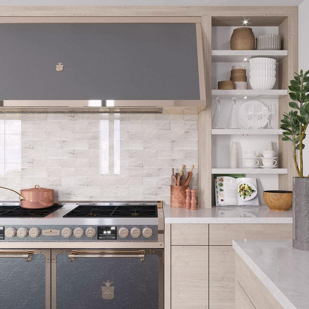 Freshen up a subway tile backsplash with Platinum sea glass tiles behind your stove