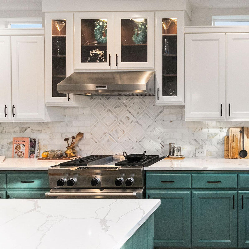 Remodeled kitchen with dark green cabinets 