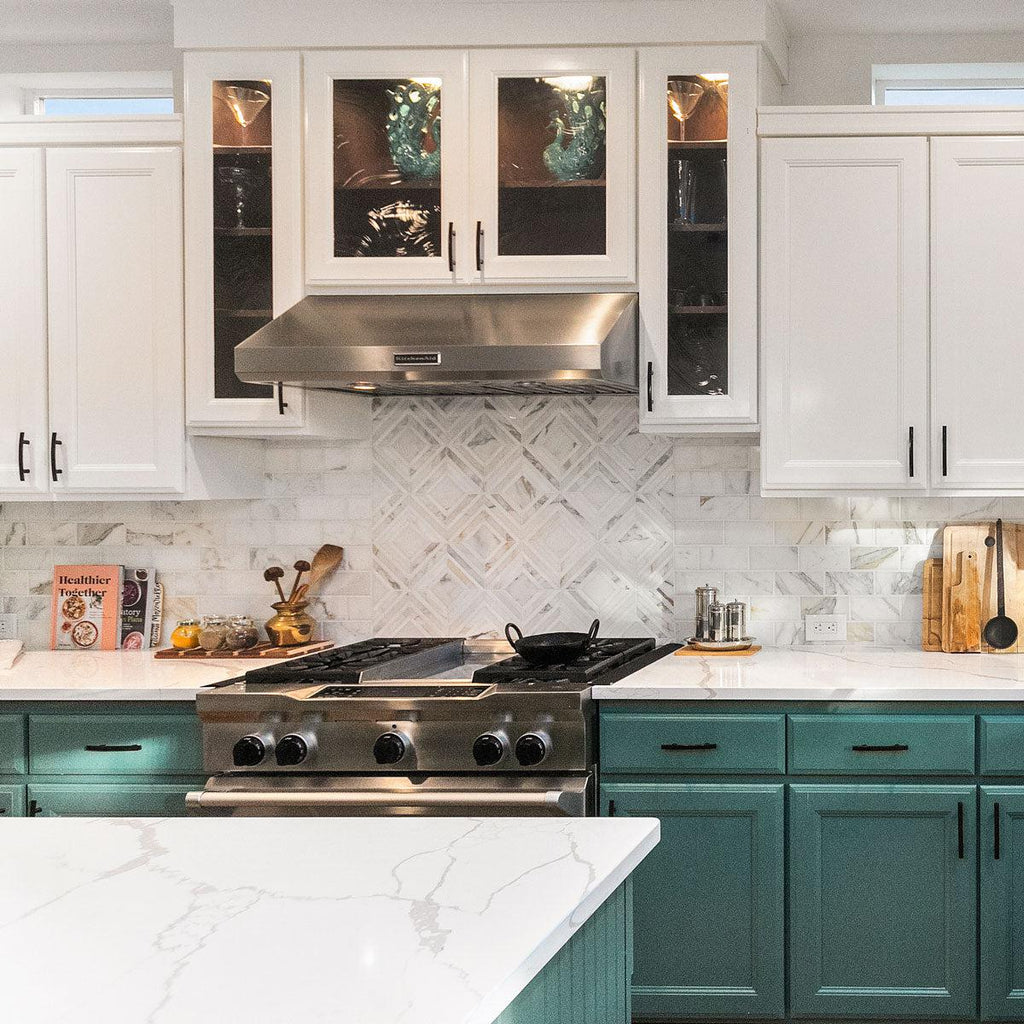 Remodeled kitchen with dark green cabinets 