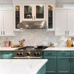 Remodeled kitchen with dark green cabinets 