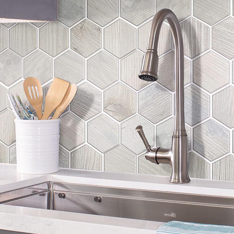 Steel Sink in Background of Painted Wood Hex White Kitchen Wall