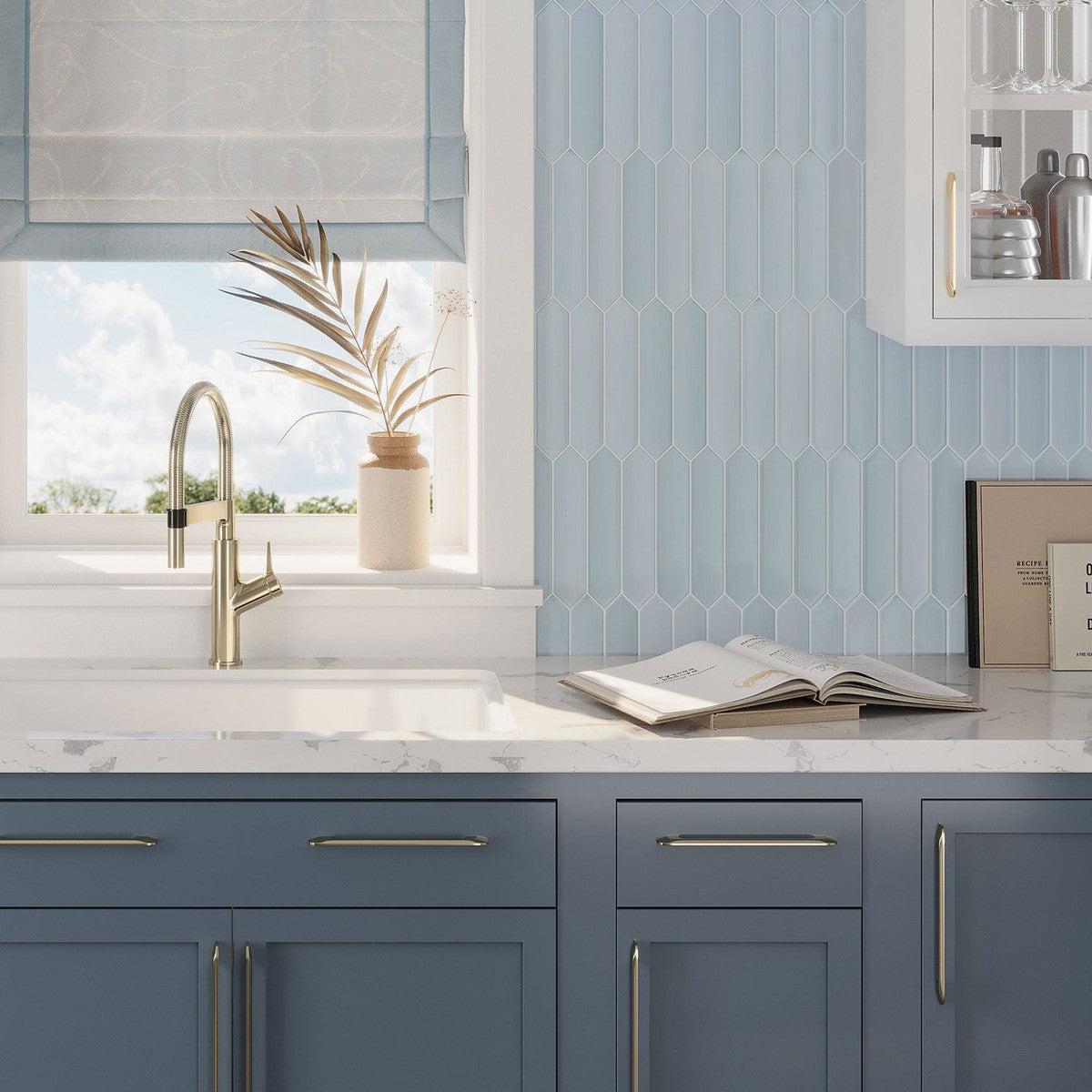 Open book on the kitchen shelf against the background of the Palisades Blue Picket Ceramic wall