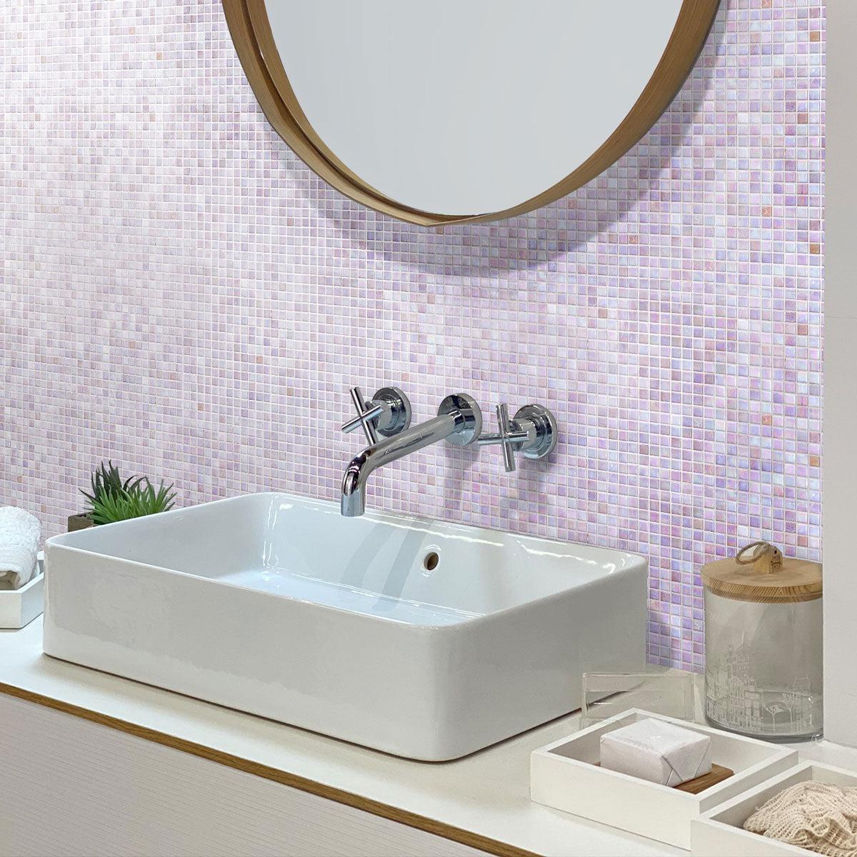 The bathroom is adorned with Pearlescent Sheer Pink and Purple Glass Pool Tile
