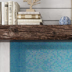 Old Wood Bookshelf above Pearly Aqua Blue Squares Glass Pool Tile Fireplace