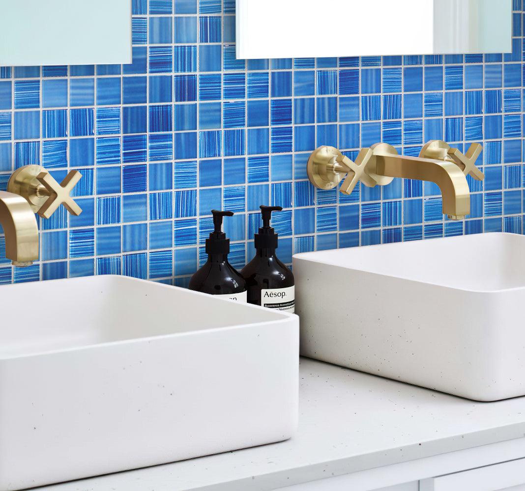 Blue tile bathroom sink backsplash