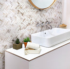 Joyful bathroom interior with recycled herringbone glass mosaic in calacatta marble color