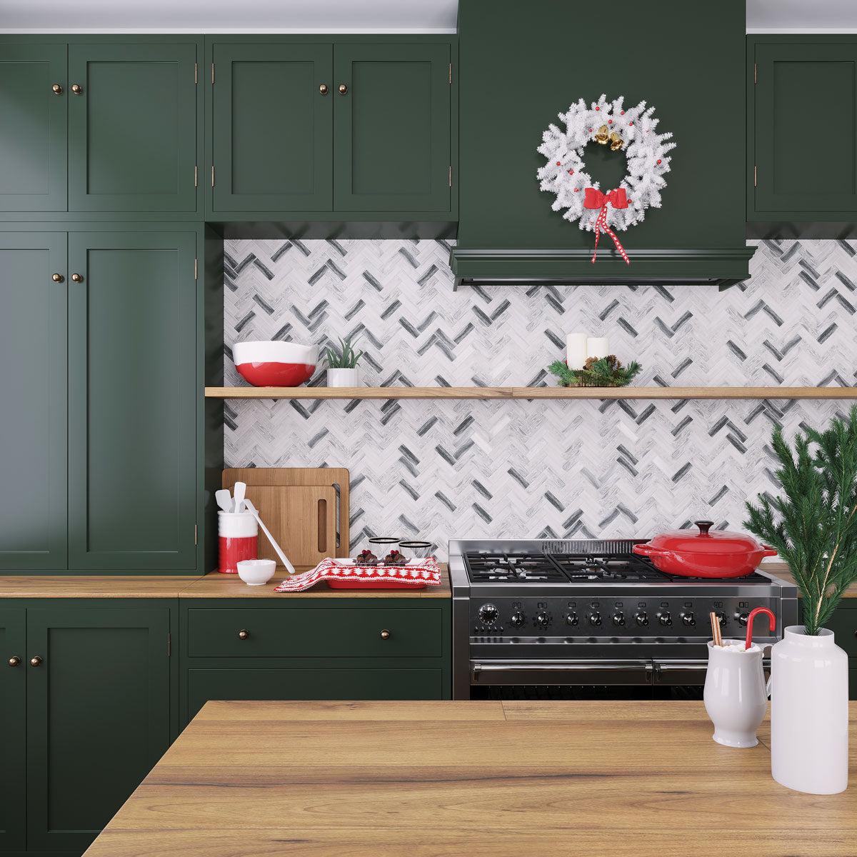 Dark green kitchen cabinets with recycled glass herringbone tile backsplash and neutral wood accents