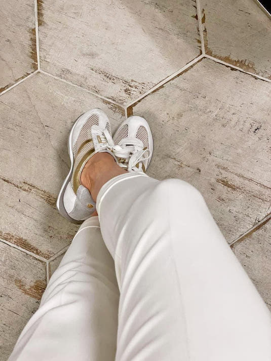 White farmhouse floor with an antiqued wood look with hexagon porcelain tiles
