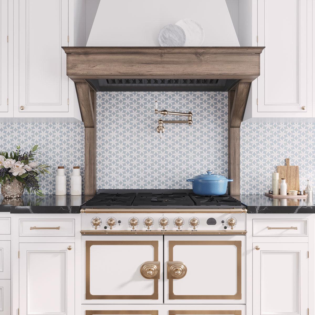 White and brass French kitchen style with Tile Club Blue Celeste and Thassos marble flower pattern tile backsplash in blue and white