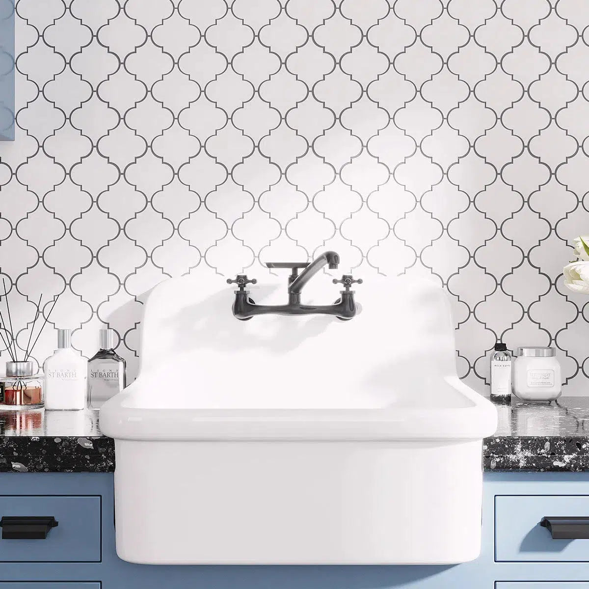 White marble arabesque tile backsplash for a blue laundry room