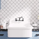 White marble arabesque tile backsplash for a blue laundry room