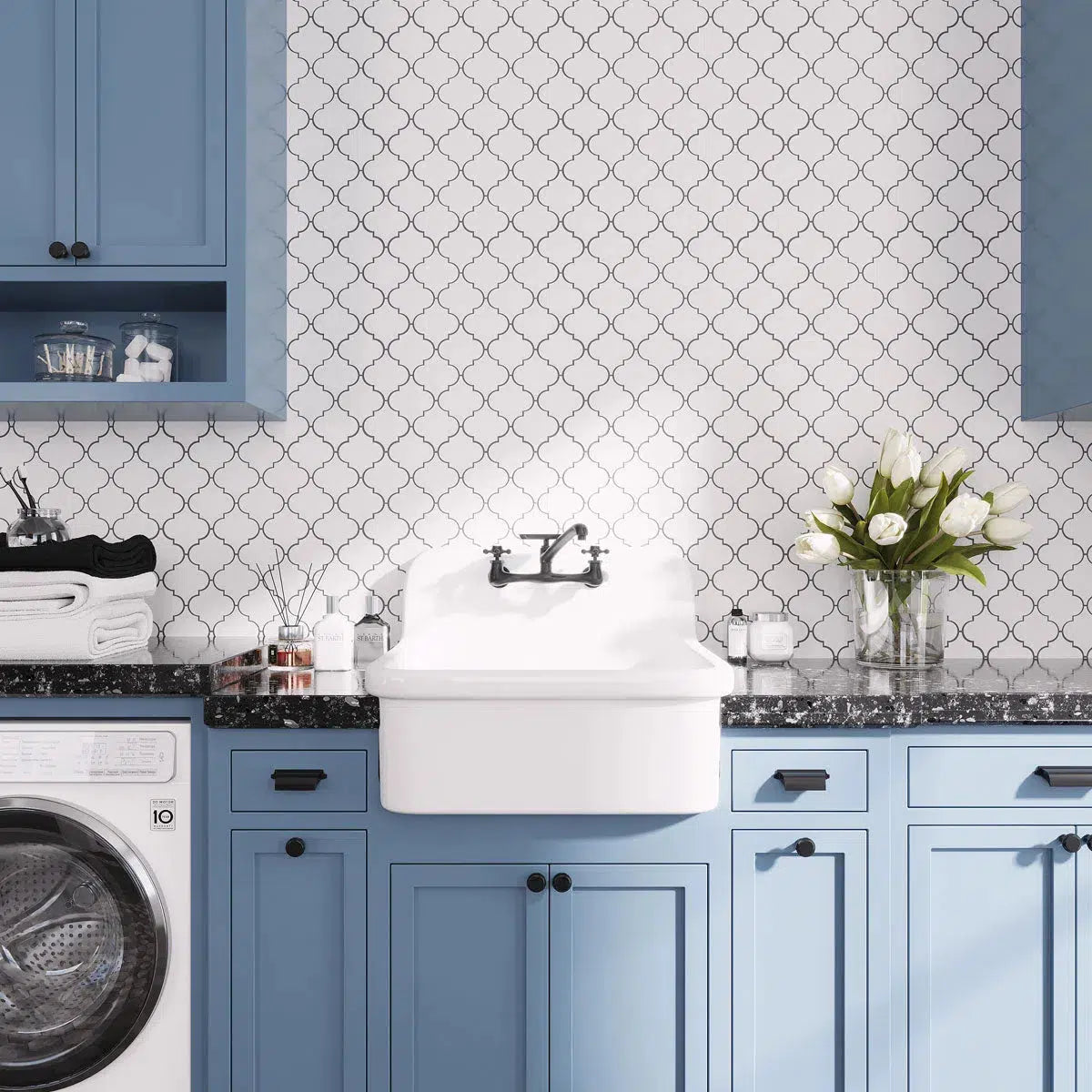 Blue and White laundry room with Arabesque tile mosaic backsplash