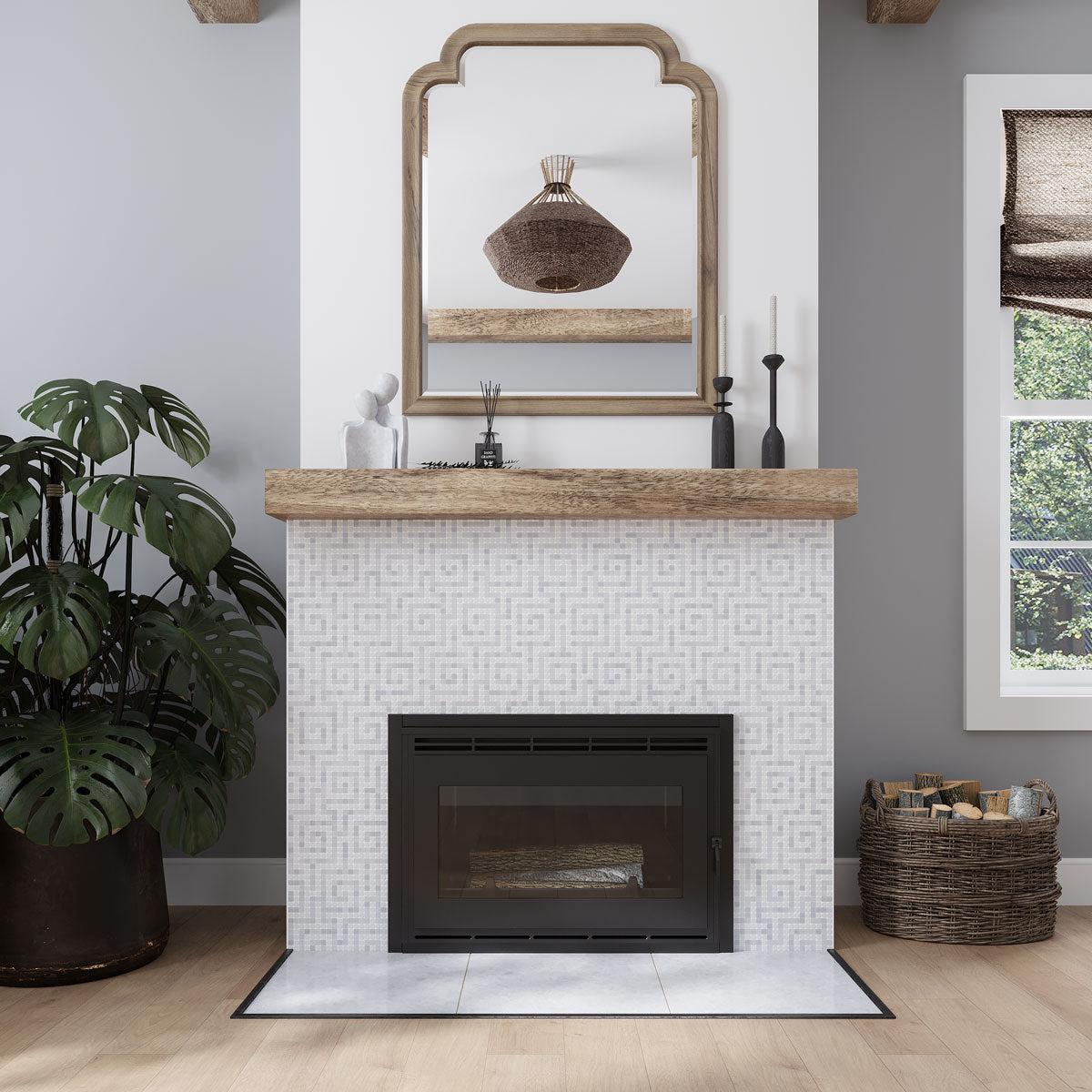 California Casual living room with a Greek key mosaic fireplace tile surround and wood mantel
