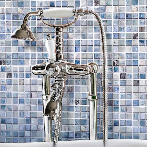 Faucet with Shower on Background of Sheer Azul Blue Mixed Squares Glass Tile 