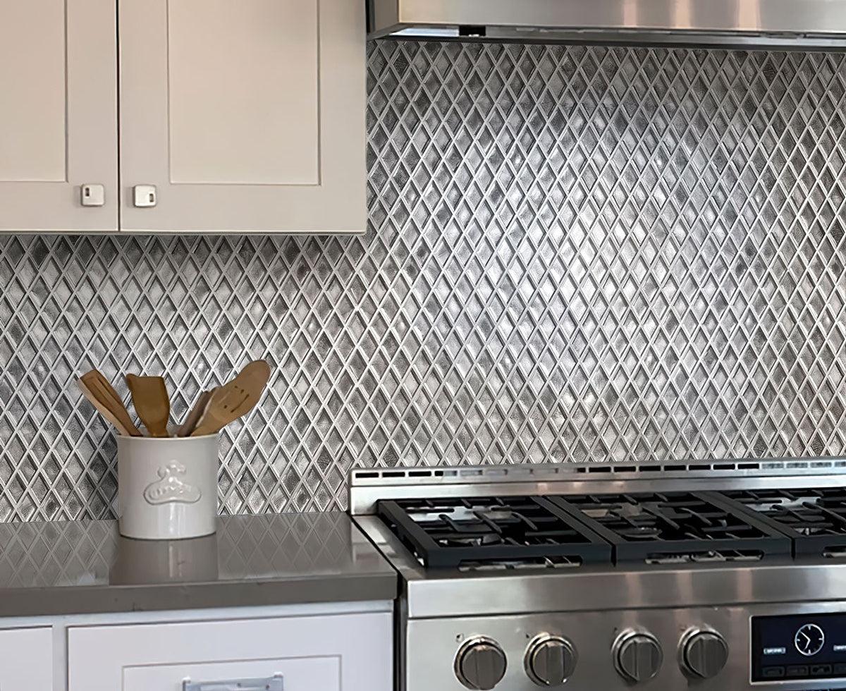 Gray and white kitchen with a wall of Silver Diamond Glass Mosaic Tile
