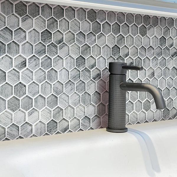 Washroom Water Tap on Background of Silver Wooden Glass Hexagon Mosaic Tile