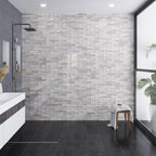 Gray and black modern bathroom with a curbless shower and wood look porcelain tile floors
