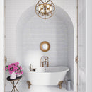 Elegant white bathroom with small marble subway tile bathroom wall