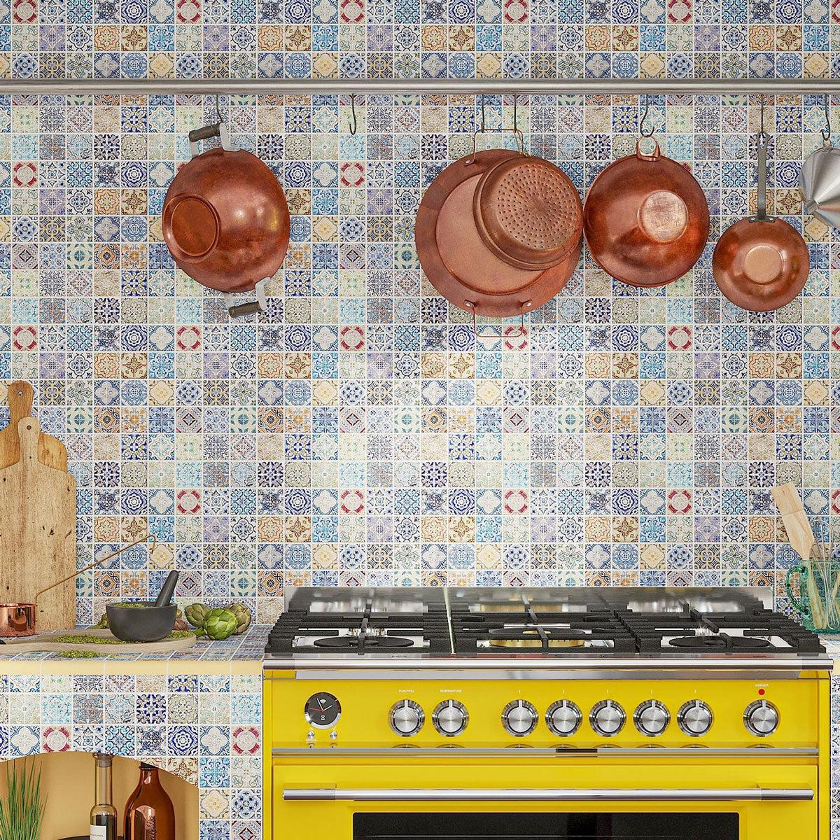 Spanish kitchen backsplash tile with yellow stove and copper kitchenware