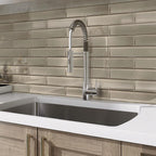Ash gray glass subway tile mosaic on a kitchen wall