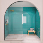 Blue glass subway tile shower wall