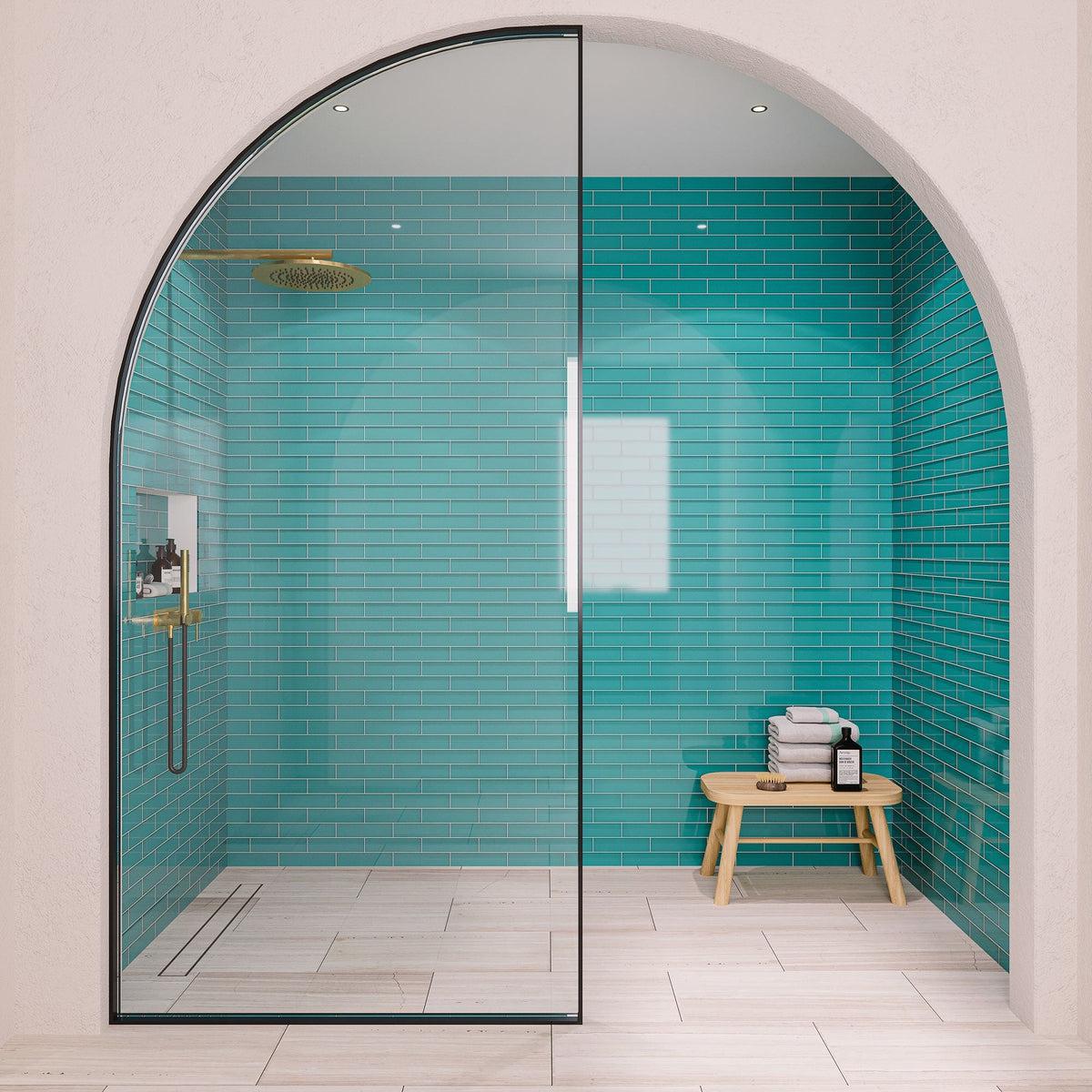 Blue glass subway tile shower wall