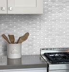 White geometric marble mosaic on kitchen wall