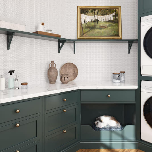 Green and white laundry room with geometric white marble mosaic tile backsplash