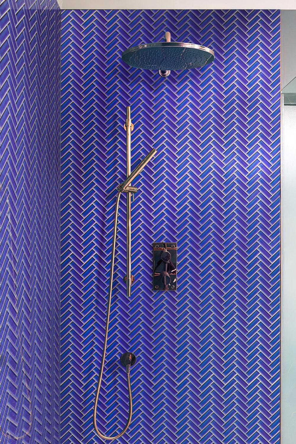 Shower with Cobalt Blue Herringbone Glass Tile walls