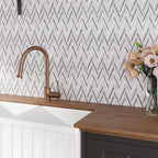 White and gray chevron tile backsplash