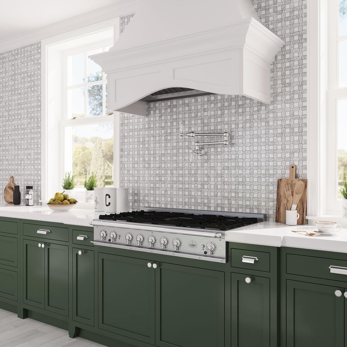 Traditional kitchen style with a modern flair thanks to Carrara and Thassos marble patterned backsplash and forest green cabinets
