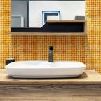 The bathroom sparkles with Topaz Pearlescent Squares Glass Tile accents