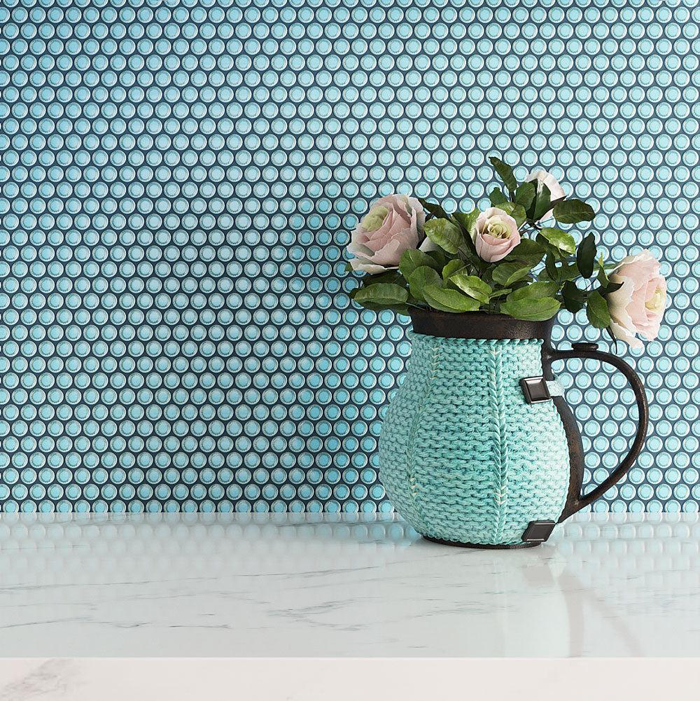 Turquoise Knitted Jug with Flowers on a urquoise Blue Buttons Porcelain Wall Background