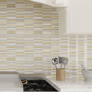 White kitchen with gold and white glass tile backsplash
