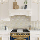 Modern white kitchen with gold and white glass tile backsplash