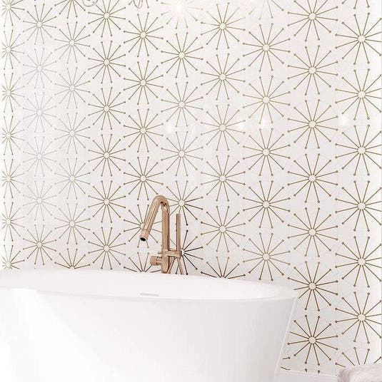 White and gold bathroom with marble and brass inlay vintage decorative tiles
