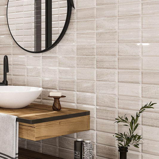 Textural marble subway tile in neutral earth tones for a spa-inspired bathroom
