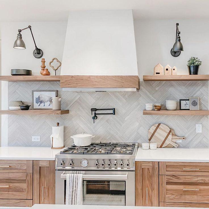 Mountain Kitchen with Floating Wood Shelves and Wood Look Marble Tile in a Herringbone Pattern
